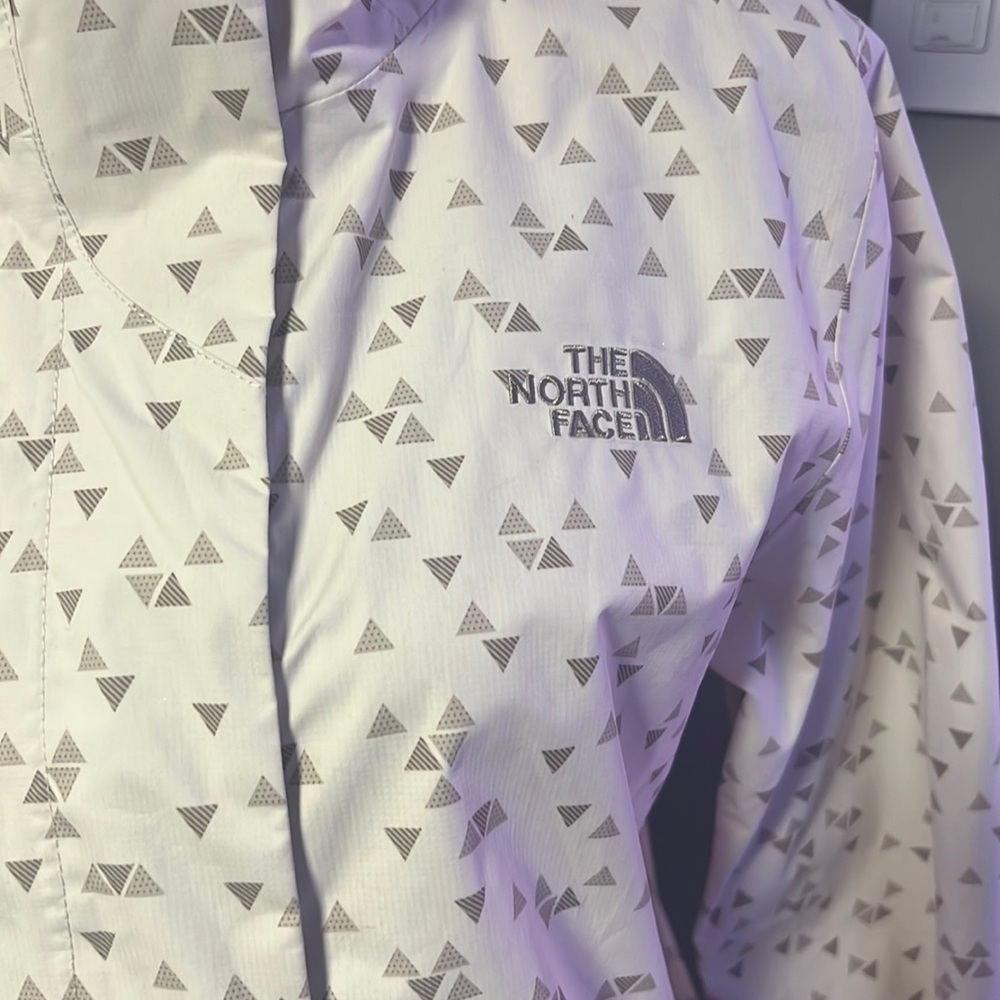 The North Fave triangle pattern rain jacket